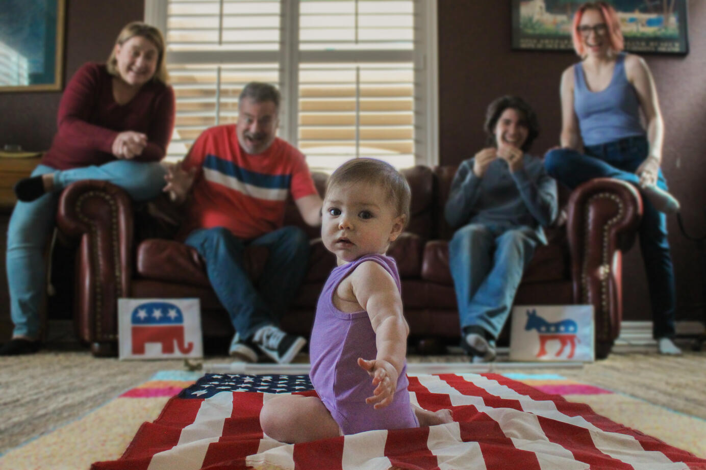 PHOTO ILLUSTRATION: "American Baby" is meant to represent generations of political party affiliation being pushed on to children when they're born. The arm reaching out is the baby reaching out to the next generation of voters to make their choice.