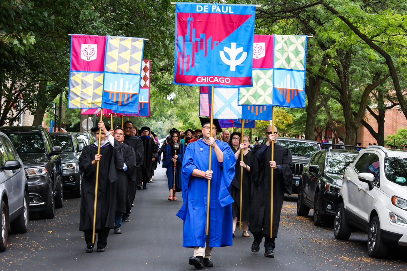 DePaul University professors walk down Fullerton Ave on their way to Convocation on September, 3. 2025. Many professors were recognized for their accomplishments and all celebrated together.