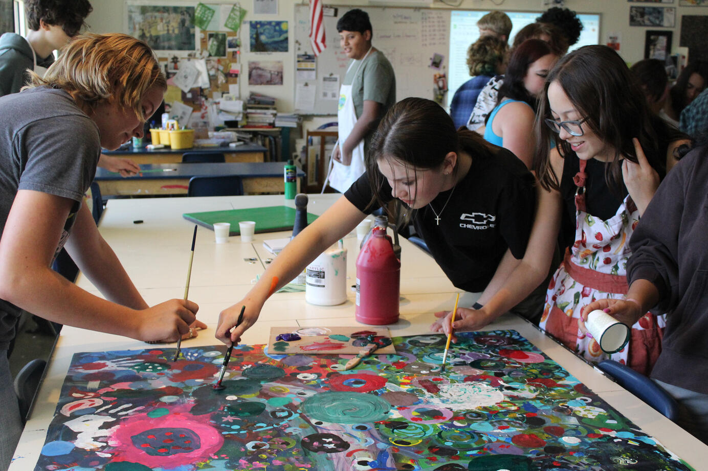 Art Club members paint a mural together at Legacy High School on August, 30, 2023. Every year the Art Club starts the first meeting off with painting circle murals as a fun activity with low stakes.