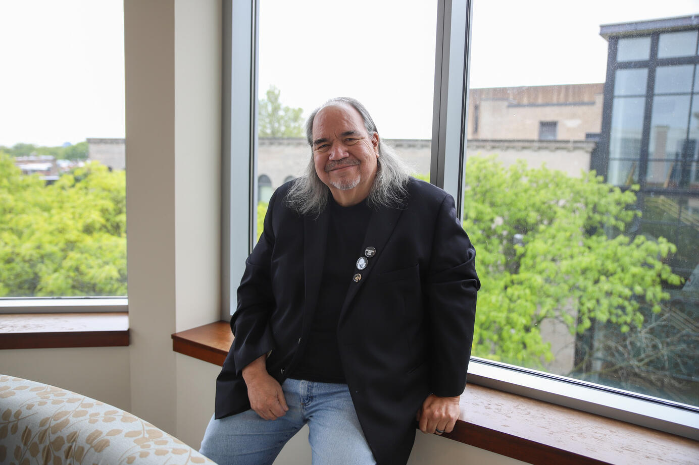 Professor Mark Turcotte sits for a photo in the Arts and Letters Hall on Wednesday, May 28, 2025. Turcotte was recently names the 6th Illinois Poet Laureate in the spring of 2025.